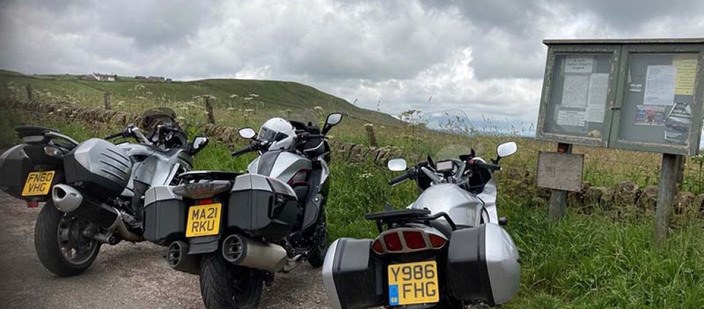 3 silver bikes overlooking view